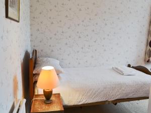 Una cama o camas en una habitación de Windways 3 fotos más