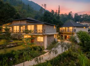 an aerial view of a house at sunset at The Orchid Rishivan, Rishikesh in Bijni