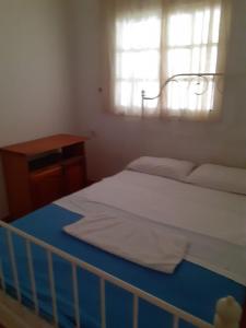 a bedroom with a bed with a crib and a window at tenerife only rooms near to beach in Los Cristianos