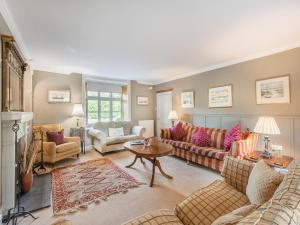 a living room with two couches and a table at The Glebe in Heckington