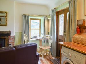 a living room with a couch and a table at St Orans in Rafford