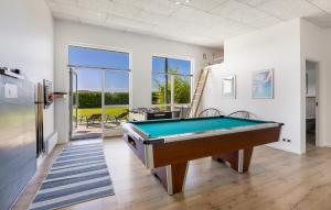 a pool table in a room with a view at Four-Bedroom Holiday Home Haderslev With A Room Hot Tub 01 in Knud