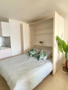 a bedroom with a bed with two pillows on it at Sea view Marigot pool studio in Saint Martin