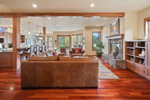 a large living room with a couch and a fireplace at Drake Park Villa in Bend