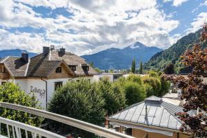 a view from the balcony of a house with mountains at Living Eden by we rent in Zell am See