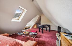 a living room with a couch and a table at Ferienwohnung Neuhermsdorf in Neuhermsdorf