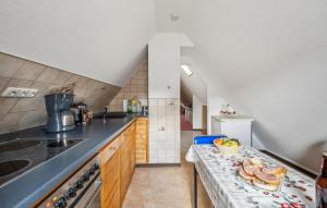 a kitchen with a counter with some food on it at Ferienwohnung Neuhermsdorf in Neuhermsdorf