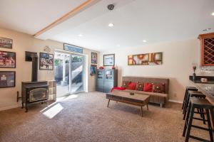 a living room with a couch and a fireplace at Northern Daylights in White Salmon +10 photos