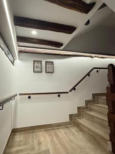 a staircase in a room with wooden floors at Arandi Baserria in Urigoiti +76 photos