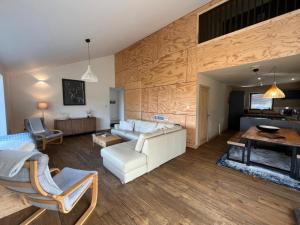 a living room with a white couch and a fireplace at White Cairn - Uk50484 in Kylestrome