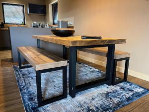a wooden table with benches and a bowl on top at White Cairn - Uk50484 in Kylestrome
