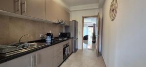 a kitchen with a sink and a counter top at Domaine de noria in Marrakesh