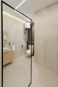 a bathroom with a toilet and a sink at Diva Suites in Hurghada +70 photos