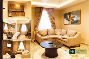 a living room with a couch and a table at King Georges Court in Mama