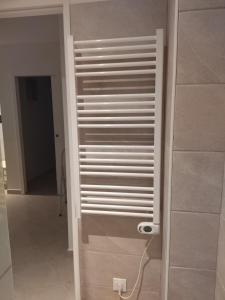 a door in a room with a wall at Appartement Amaryllis in Le Boulou +6 photos