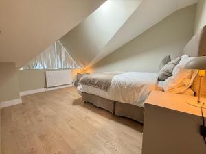 Ένα ή περισσότερα κρεβάτια σε δωμάτιο στο BritLodge Home