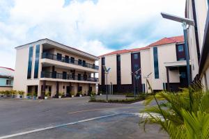 a parking lot in front of a building at King Georges Court in Mama