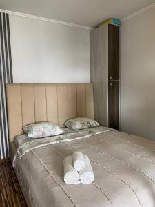 Postel nebo postele na pokoji v ubytování ApartLux on Pobedy Avenue + 3 fotografie