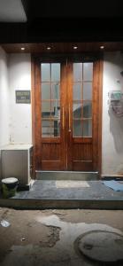 an entrance to a building with wooden doors at Arora golden guest house in Amritsar