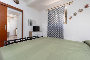 Ένα ή περισσότερα κρεβάτια σε δωμάτιο στο AltoRione