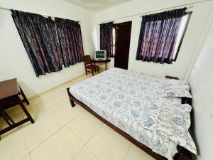 Ένα ή περισσότερα κρεβάτια σε δωμάτιο στο Sky Blue