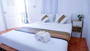 Baanlek Guest Houseにあるベッド