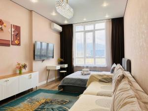 Μια τηλεόραση ή/και κέντρο ψυχαγωγίας στο Apartments near Mega Park