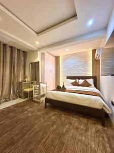 Ένα ή περισσότερα κρεβάτια σε δωμάτιο στο The Champagne Suite