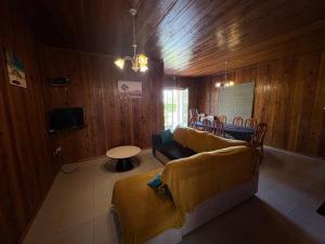 a living room with a couch and a table at Marie Begue Villa in Cilaos