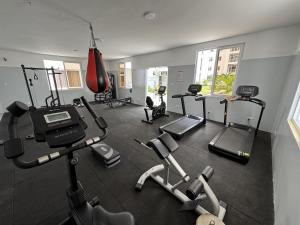 a gym with several treadmills and exercise bikes at Ocean waves in Mombasa