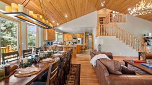 a dining room with a long wooden table and chairs at Linaker Lodge by AvantStay Gorgeous Cabin in Big Bear w Views in Big Bear Lake