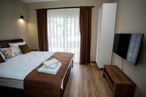 Ένα ή περισσότερα κρεβάτια σε δωμάτιο στο Wine Region Hotel