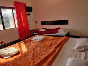 Ένα ή περισσότερα κρεβάτια σε δωμάτιο στο Hotel Rahil International