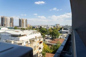 a view of a city from the balcony of a building at Modern Duplex Loft in Skopje City Center with 3 Bedrooms in Skopje +17 photos