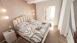 a bedroom with a large bed in a room at LuxHome by Lake Neusiedl with Jakuzzi in Fertőszentmiklós +51 photos