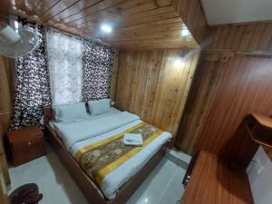 Postel nebo postele na pokoji v ubytování Hotel Rashak