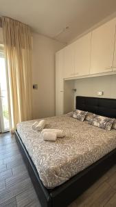 Ένα ή περισσότερα κρεβάτια σε δωμάτιο στο B&B Mima
