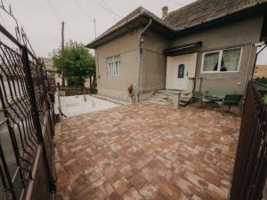 a brick patio in front of a house at Casa RusTic in Turda