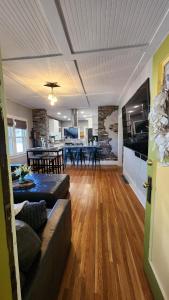 a living room with a couch and a table at Plunge Pool Haven King bed in Loveland