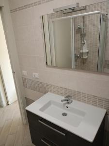 Koupelna v ubytování Corte Don Bosco 3 + 5 fotografií