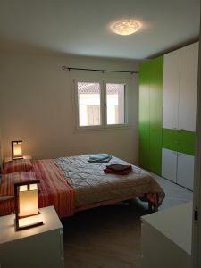 Postel nebo postele na pokoji v ubytování Corte Don Bosco 3