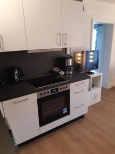 Kuchyň nebo kuchyňský kout v ubytování Madlen Apart + 2 fotografie