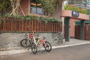 two bikes parked on the side of a building at Hanoi Riverview Boutique Hotel & Apartment in Hanoi +134 photos
