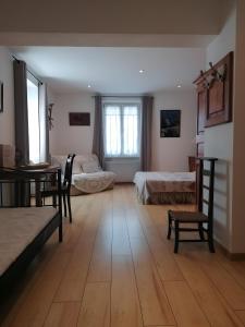 Postel nebo postele na pokoji v ubytování À L'ancienne Boulangerie - Chambres