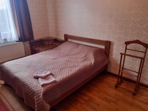 a bedroom with a bed with a towel on it at Felicità Family Club 