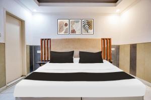 Ένα ή περισσότερα κρεβάτια σε δωμάτιο στο Hotel O HAPPY STAY INN