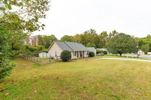 a house with a large yard in front of a house at Family & Couples Getaway Near Lake Norman Firepit King Suite in Troutman