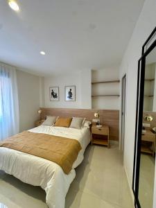 a bedroom with a large bed in a room at Picasso 2 Royale in Marbella