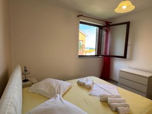 En eller flere senge i et værelse på Apartment Marina