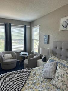 a bedroom with a bed and a couch and a chair at Relax with Spacious Modern Simplicity in Boerne